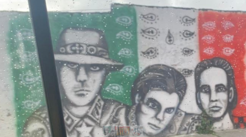 En el extremo sur del mural sobresalen tres rostros sobre el fondo de la bandera de México que cubre toda la pared. Los postes de luz también tienen estos distintivos. Foto: EL COMERCIO